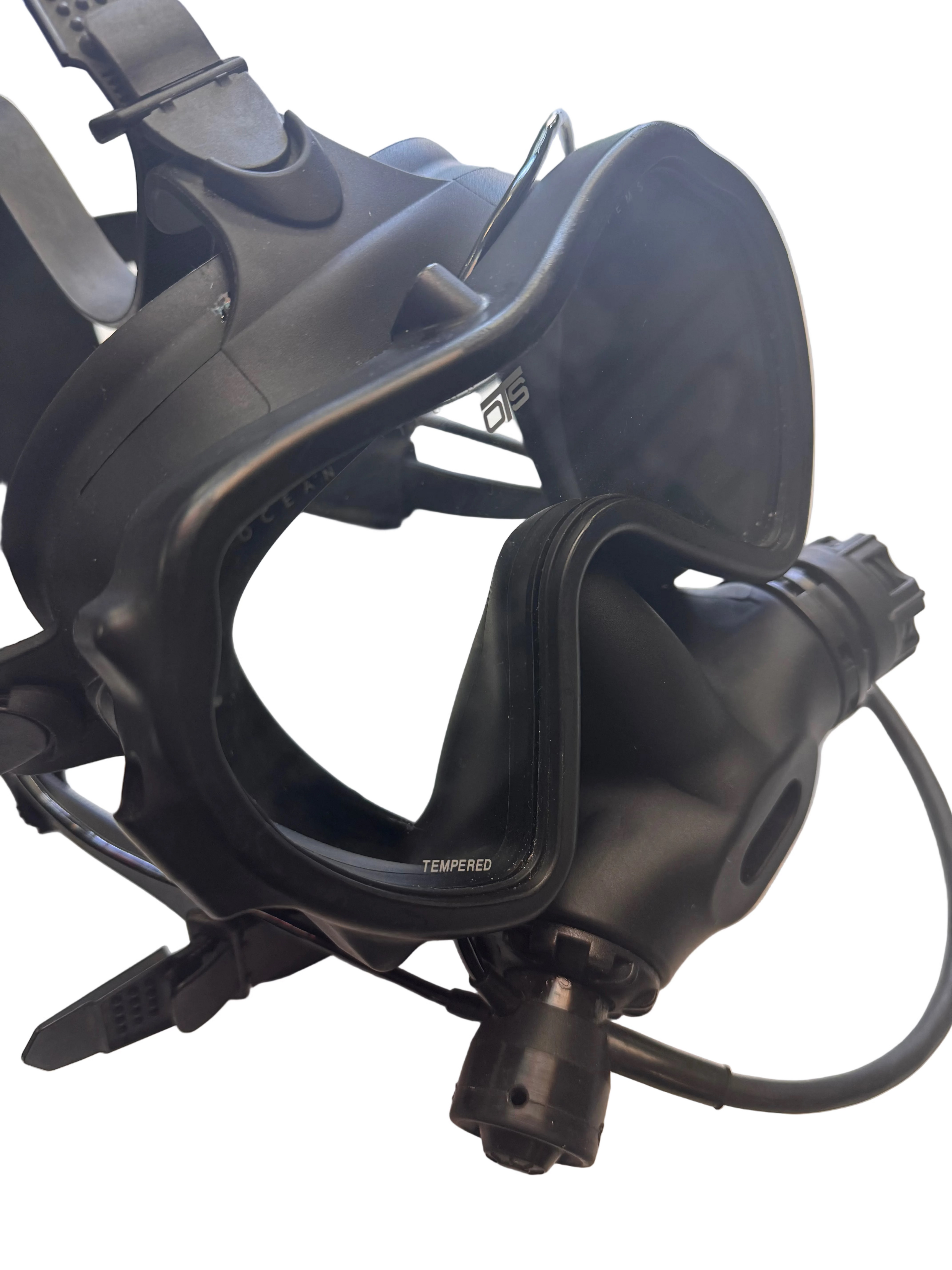 Black diving mask on a light-colored surface